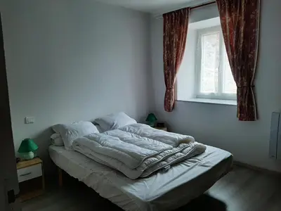 Un ou plusieurs lits dans un hébergement de l'établissement Appartement Le Paradou à Besse