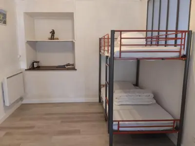 Un ou plusieurs lits dans un hébergement de l'établissement Appartement Le Paradou à Besse
