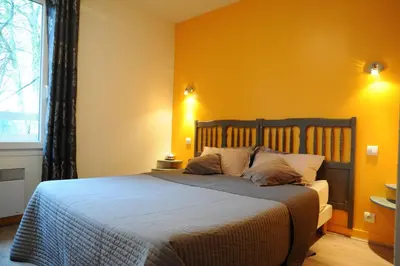 Un ou plusieurs lits dans un hébergement de l'établissement Hôtel du Lac