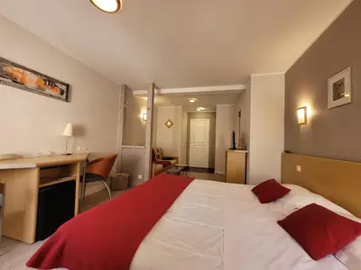 Un ou plusieurs lits dans un hébergement de l'établissement Hotel Fouillade