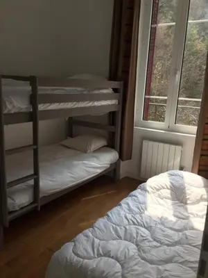 Un ou plusieurs lits dans un hébergement de l'établissement Magnifique et lumineux appartement au cœur du Sancy