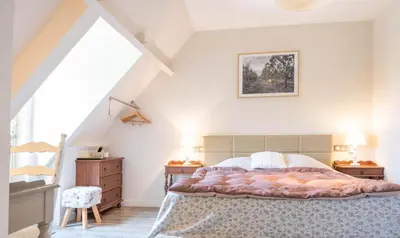 Un ou plusieurs lits dans un hébergement de l'établissement Logis hotel-restaurant les collines 59 route des crêtes