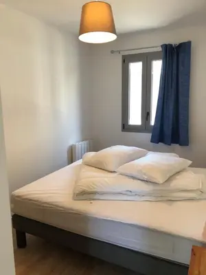 Un ou plusieurs lits dans un hébergement de l'établissement Les gîtes du paradis