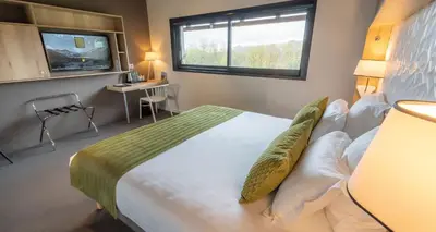 Un ou plusieurs lits dans un hébergement de l'établissement Mildiss Hotel Spa & Restaurant, BW Signature Collection