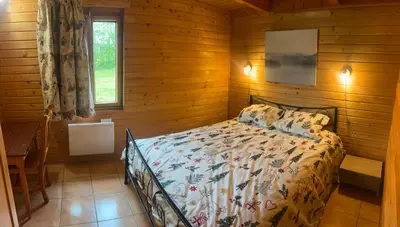 Un ou plusieurs lits dans un hébergement de l'établissement Chalets de l Empereur