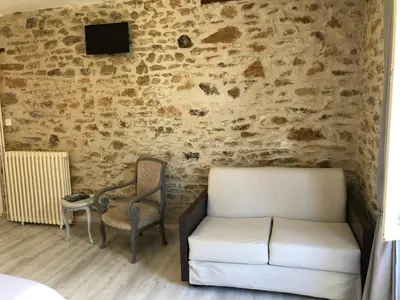 Coin salon dans l'établissement Les Tilleuls