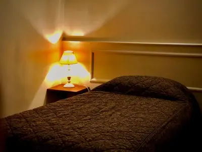 Un ou plusieurs lits dans un hébergement de l'établissement Le Grand Hôtel