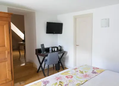 Télévision ou salle de divertissement dans l'établissement Hotel Beau Site - Rocamadour
