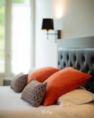Un ou plusieurs lits dans un hébergement de l'établissement Hotel Beau Site - Rocamadour