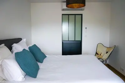 Un ou plusieurs lits dans un hébergement de l'établissement L'Eden Urbain - 2 Chambres