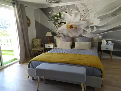Un ou plusieurs lits dans un hébergement de l'établissement Ma villa au bord de l'eau