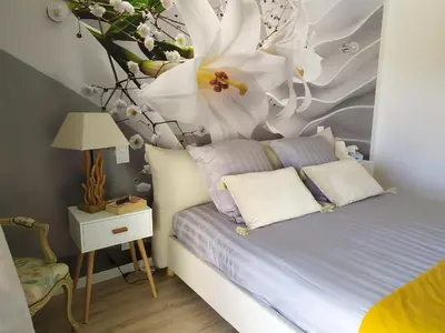 Un ou plusieurs lits dans un hébergement de l'établissement Ma villa au bord de l'eau