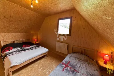 Un ou plusieurs lits dans un hébergement de l'établissement Chalet Puy Ferrand