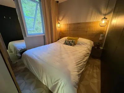 Un ou plusieurs lits dans un hébergement de l'établissement Parc de vacances La Draille