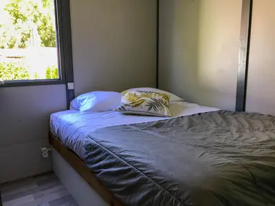 Un ou plusieurs lits dans un hébergement de l'établissement Parc de vacances La Draille