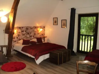 Un ou plusieurs lits dans un hébergement de l'établissement La maison du rocher