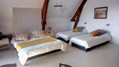 Un ou plusieurs lits dans un hébergement de l'établissement La maison du rocher