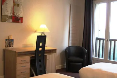 Un ou plusieurs lits dans un hébergement de l'établissement Hôtel des Chazes
