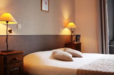 Un ou plusieurs lits dans un hébergement de l'établissement Hôtel des Chazes