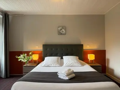 Un ou plusieurs lits dans un hébergement de l'établissement Hôtel des Chazes