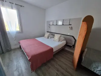 Un ou plusieurs lits dans un hébergement de l'établissement Amadour Hôtel