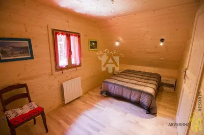 Un ou plusieurs lits dans un hébergement de l'établissement Chalet des Noisettes
