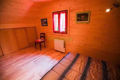 Un ou plusieurs lits dans un hébergement de l'établissement Chalet des Noisettes