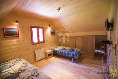 Un ou plusieurs lits dans un hébergement de l'établissement Chalet des Noisettes