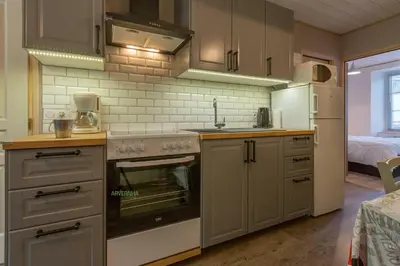 Cuisine ou kitchenette dans l'établissement Le Petit Lutess