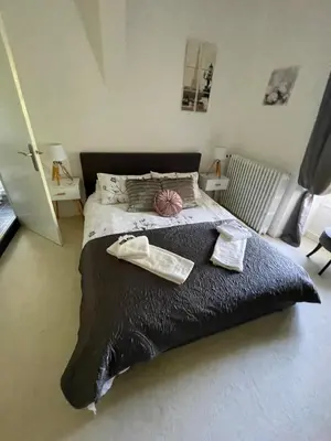 Un ou plusieurs lits dans un hébergement de l'établissement Vue du Château d'Excideuil en chambres