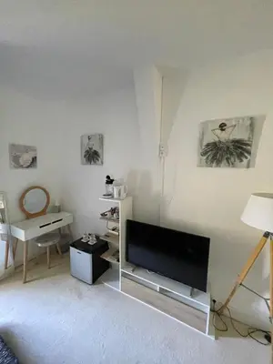Télévision ou salle de divertissement dans l'établissement Vue du Château d'Excideuil en chambres