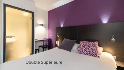 Un ou plusieurs lits dans un hébergement de l'établissement Kyriad Direct Limoges Nord