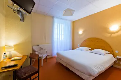 Un ou plusieurs lits dans un hébergement de l'établissement Hôtel du Parc