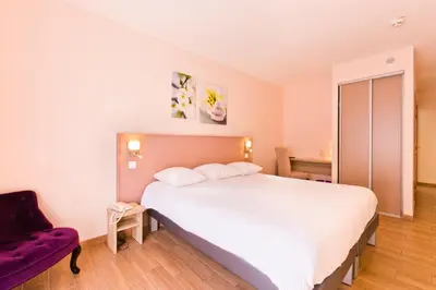 Un ou plusieurs lits dans un hébergement de l'établissement Hôtel du Parc