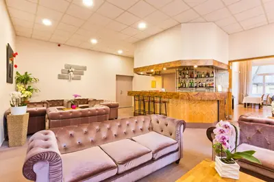Coin salon dans l'établissement Hôtel du Parc