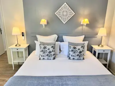 Un ou plusieurs lits dans un hébergement de l'établissement Hôtel Les Vieilles Tours Rocamadour