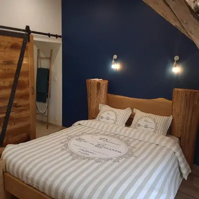 Un ou plusieurs lits dans un hébergement de l'établissement L'étable gourmande chambres d'hôtes et ferme auberge