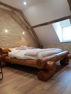 Un ou plusieurs lits dans un hébergement de l'établissement L'étable gourmande chambres d'hôtes et ferme auberge