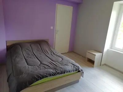 Un ou plusieurs lits dans un hébergement de l'établissement Maison à la campagne au cœur du Cantal dept 15
