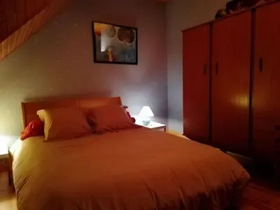 Un ou plusieurs lits dans un hébergement de l'établissement Maison typique pleine de charme Peyrusse Cantal