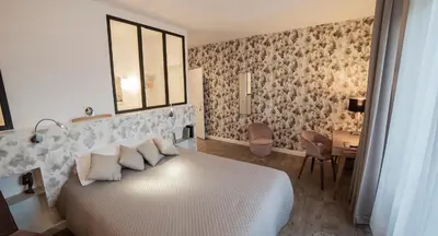 Un ou plusieurs lits dans un hébergement de l'établissement Les chambres de l'ATELIER à Montignac Lascaux