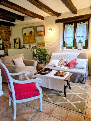 Coin salon dans l'établissement Gîte le pré des Colombes