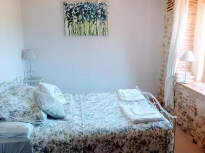 Un ou plusieurs lits dans un hébergement de l'établissement Dordogne Farmhouse