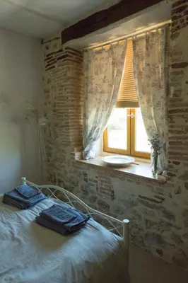 Un ou plusieurs lits dans un hébergement de l'établissement Dordogne Farmhouse
