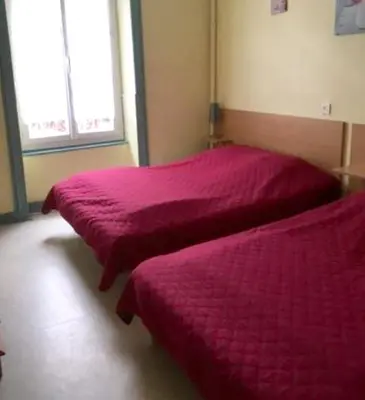 Un ou plusieurs lits dans un hébergement de l'établissement Appartement cosy à La Bourboule, 40 m², casier à skis