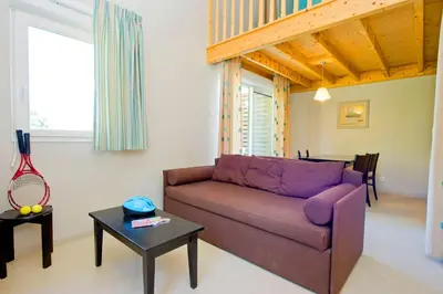 Coin salon dans l'établissement Résidence Goélia Les Cottages du Lac