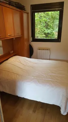Un ou plusieurs lits dans un hébergement de l'établissement appartement chaleureux avec terrasse ensoleillée 2 étoiles