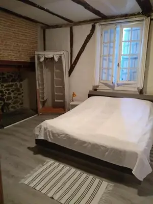 Un ou plusieurs lits dans un hébergement de l'établissement Le Petit Chat