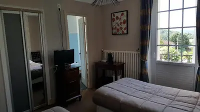 Un ou plusieurs lits dans un hébergement de l'établissement Hôtel du Puy d'Alon