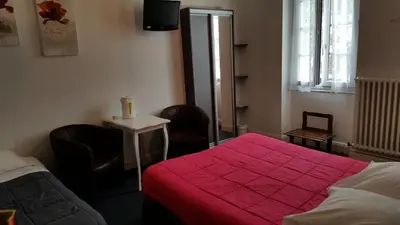 Un ou plusieurs lits dans un hébergement de l'établissement Hôtel du Puy d'Alon